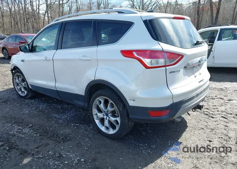 2016 Ford Escape Titanium z USA, uszkodzony, nr VIN 1FMCU9J94GUA89427